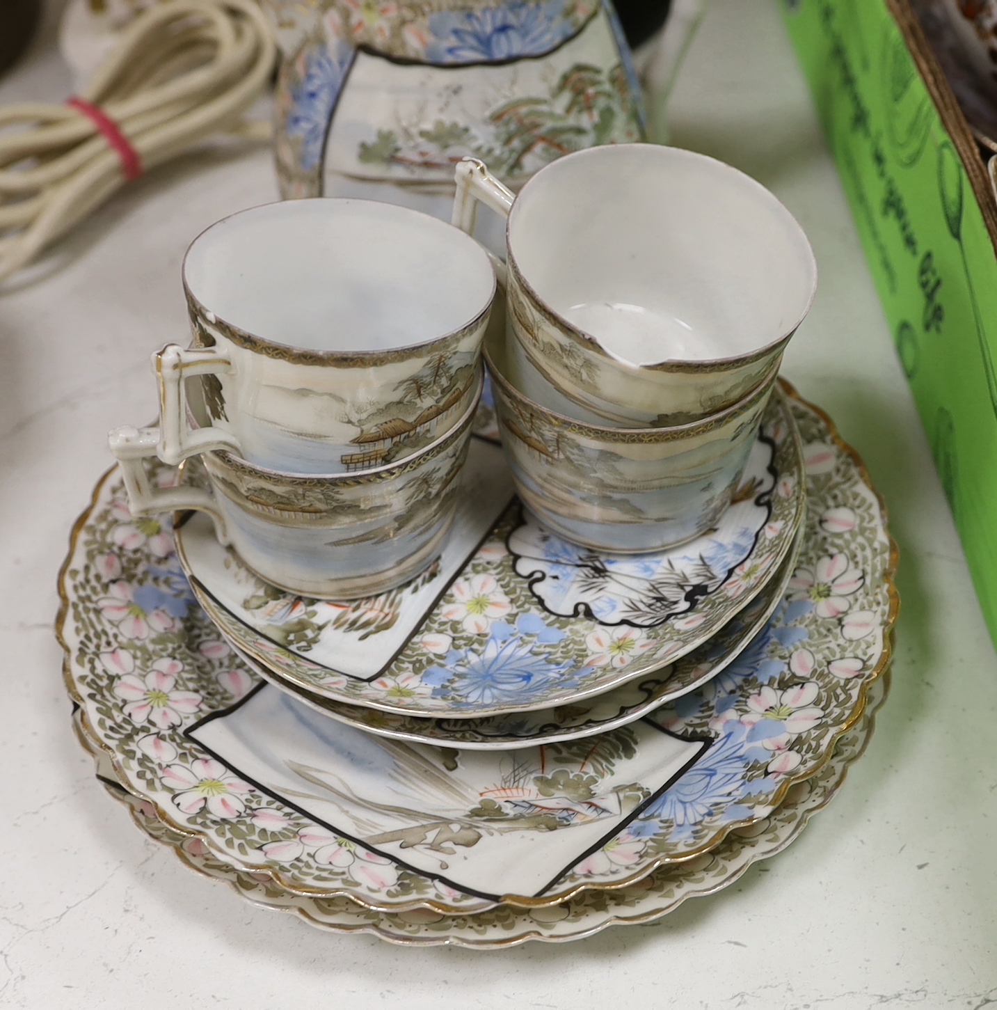 A group of Japanese ceramics, possibly Meiji including a teapot, a miniature Kutani vase and Japanese fluted bowls, etc., largest 21cm in diameter, a Japanese Satsuma lamp base and a pot and cover, possibly Meiji period,